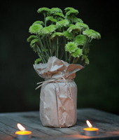Vase covered with craft paper bag - Photo from bvweddings.com