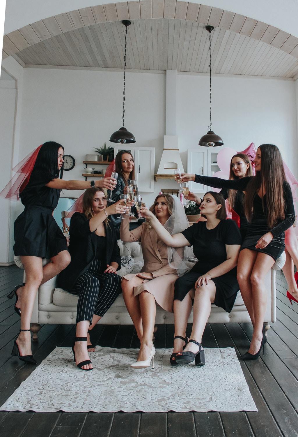 bachelorette party group of women sitting on white floor