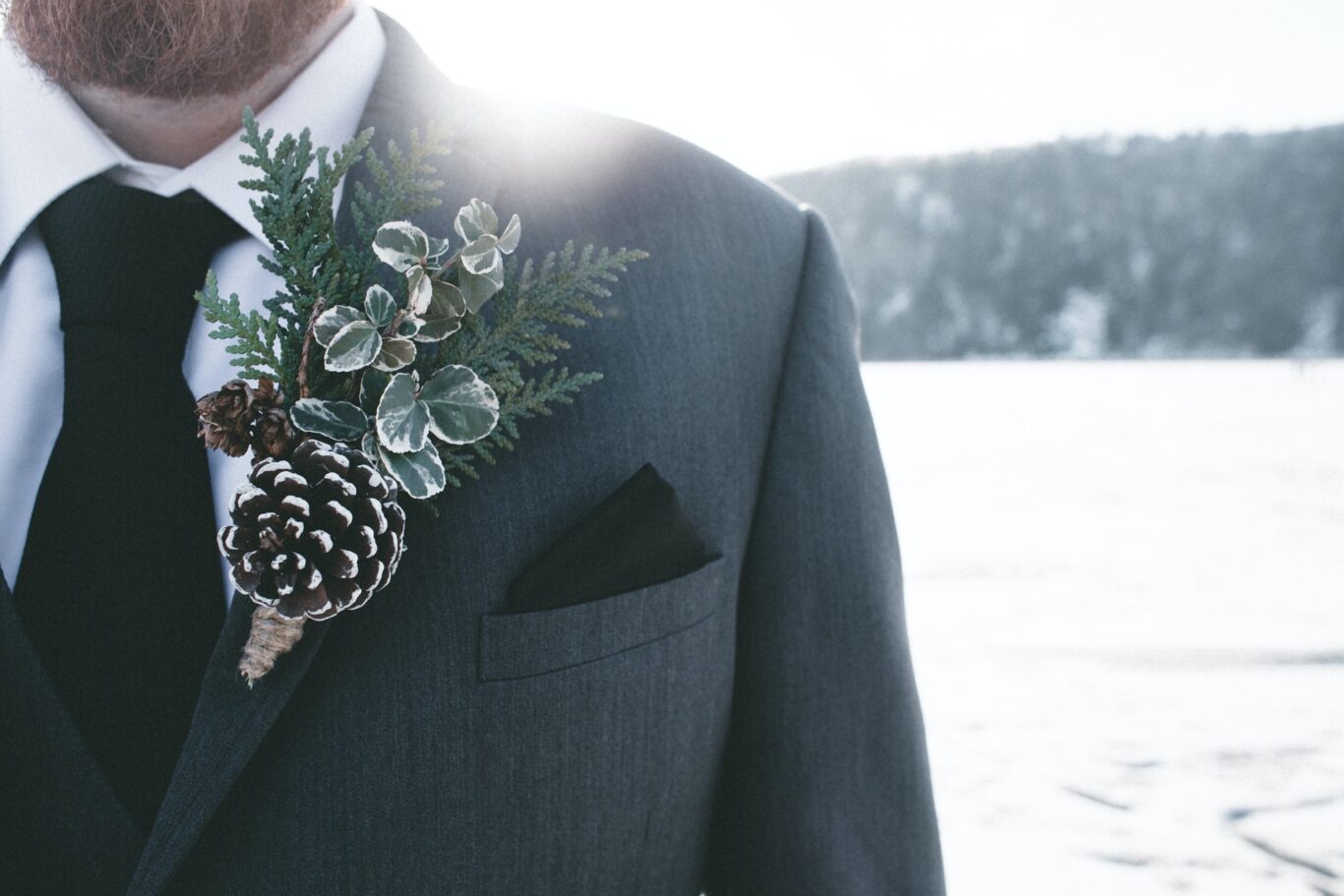 christmas wedding man in gray blazer with corsage